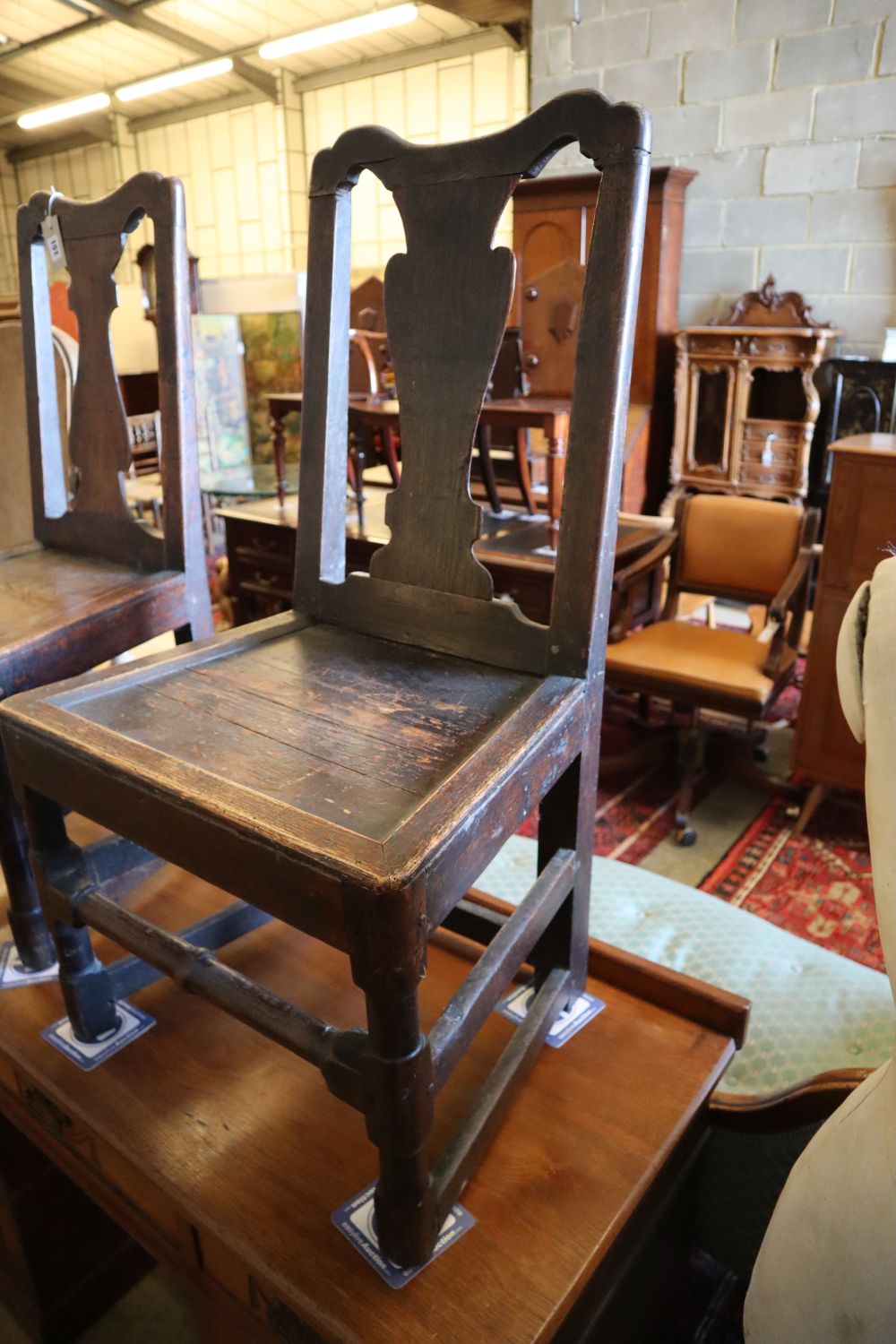 A pair of 18th century oak dining chairs
